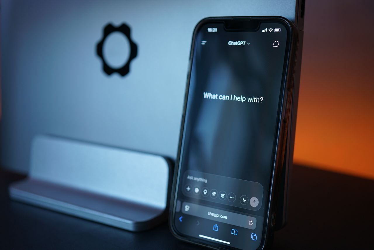 who-we-are Close-up of a smartphone with AI chat interface, showcasing advanced technology in a sleek design.